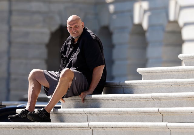 WASHINGTON, DC - OCTOBER 01: U.S. Sen. John Fetterman (D-PA) sits on the steps of the U.S. Capitol on October 01, 2025 in Washington, DC. The federal government shut down early Wednesday after Congress and the White House failed to reach a funding deal. (Photo by Kevin Dietsch/Getty Images)