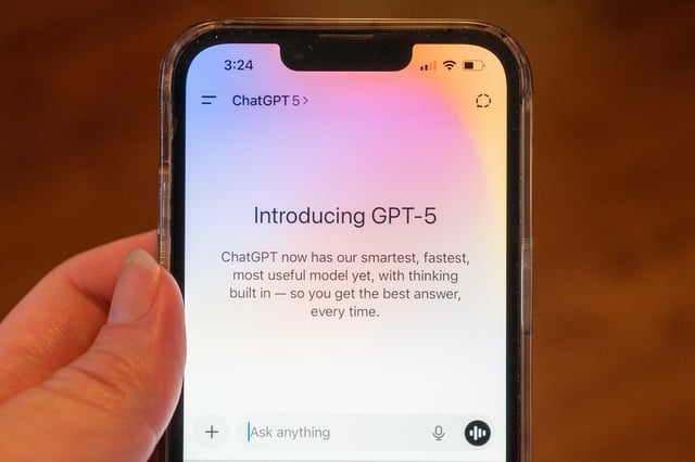 Close-up of a person's hand using the OpenAI GPT-5 artificial intelligence model on an iPhone, with text introducing the model, Lafayette, California, August 7, 2025. (Photo by Smith Collection/Gado/Getty Images)