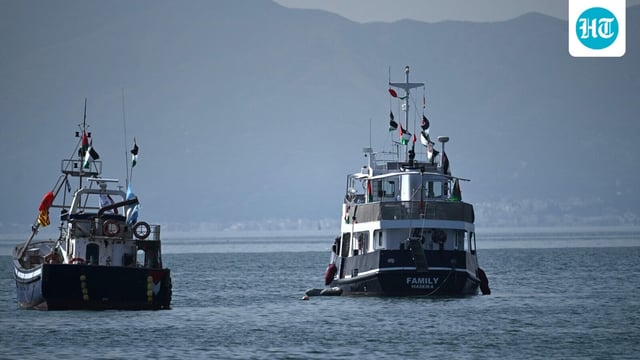 A ship (R), known as the Family and is part of the Global Sumud Flotilla, is anchored off the coast of the village of Sidi Bou Said on September 9, 2025. (Photo by FETHI BELAID / AFP)