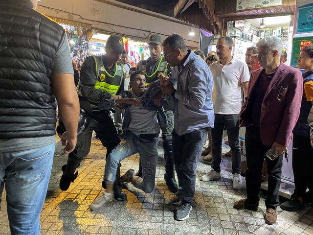 Members of the security forces detain a man as they prevent a protest demanding reforms in education and health from taking place, in Rabat, Morocco, September 29, 2025. REUTERS/Ahmed El Jechtimi