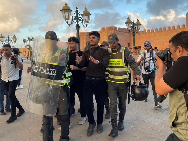 Members of the security forces detain a man as they prevent a protest demanding reforms in education and health from taking place, in Rabat, Morocco, September 29, 2025. REUTERS/Ahmed El Jechtimi