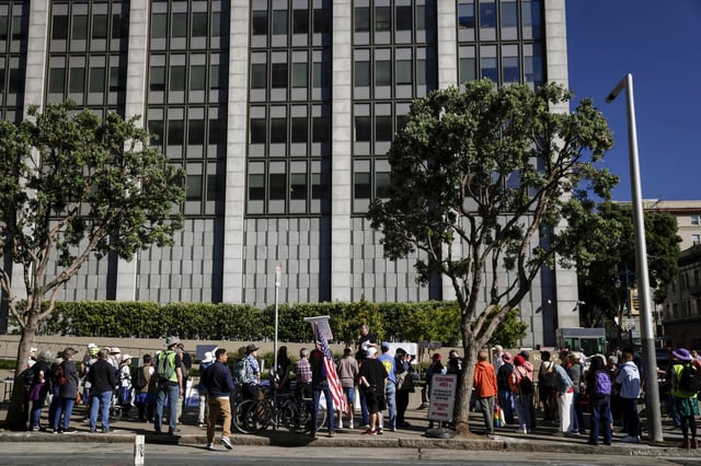 Federal union workers and supporters protest the firings of members of the federal workforce at the Philip Burton Federal Building on Labor Day in San Francisco on Sept. 1, 2025. 