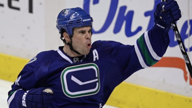 Vancouver Canucks defenceman Willie Mitchell celebrates a goal against the Pittsburgh Penguins on Jan. 16, 2010. 