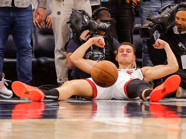 Miami Heat forward Nikola Jovic (5) celebrates his basket which, following a free throw and a defensive stop, defeats the Minnesota Timberwolves late in the fourth quarter of an NBA basketball game Sunday, Nov. 10, 2024, in Minneapolis. (AP Photo/Bruce Kluckhohn)