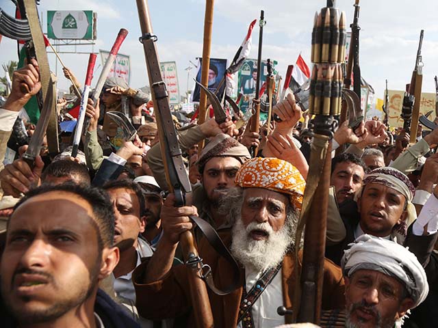 Yemenis brandish weapons, flags of Yemen and Palestine, and anti-US and Israel emblems and shout slogans during a protest staged in solidarity with the people of Gaza on September 26, 2025 in Sana'a, Yemen. The Yemen-based Houthi group said eight people were killed and more than 140 others were injured, including four children, two women, and three elderly individuals, in Israel's Thursday airstrikes on Sana'a. (Photo by Mohammed Hamoud/Getty Images)