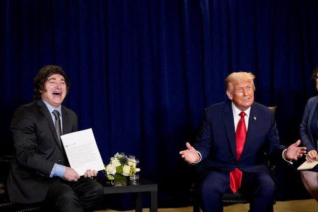 U.S. President Donald Trump and Argentina's President Javier Milei react as they meet during the 80th United Nations General Assembly, in New York City, New York, U.S., September 23, 2025. REUTERS/Al Drago/File Photo