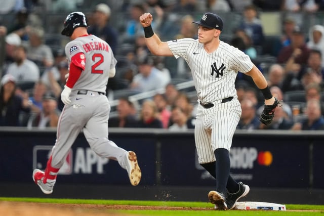 New York Yankees first base Ben Rice reacts as he tags the bag for the out completing the double play on a ball hit by Boston Red Sox Alex Bregman (2) to end the top of the third inning of Game 2 of an American League wild-card baseball playoff series, Wednesday, Oct. 1, 2025, in New York. (AP Photo/Yuki Iwamura)