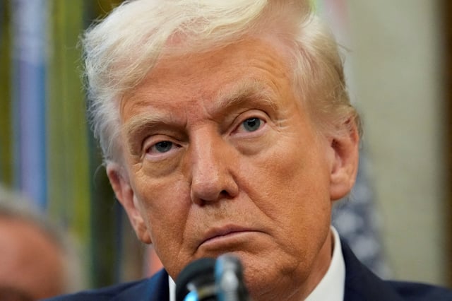 U.S. President Donald Trump looks on as he announces a deal with Pfizer to sell drugs at lower prices, in the Oval office of the White House in Washington, D.C., U.S., September 30, 2025. REUTERS/Ken Cedeno