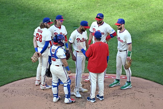 Sep 28, 2025; Philadelphia, Pennsylvania, USA; Philadelphia Phillies manager Rob Thomson (49) talks with pitcher Cristopher Sanchez (61) before being removed from the game against the Minnesota Twins during the sixth inning at Citizens Bank Park. Mandatory Credit: Eric Hartline-Imagn Images