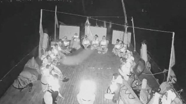 Crew members sit in a circle aboard an aid vessel bound for Gaza, one of about 50 such boats forming the latest flotilla which was intercepted by the Israeli navy late on Wednesday. 