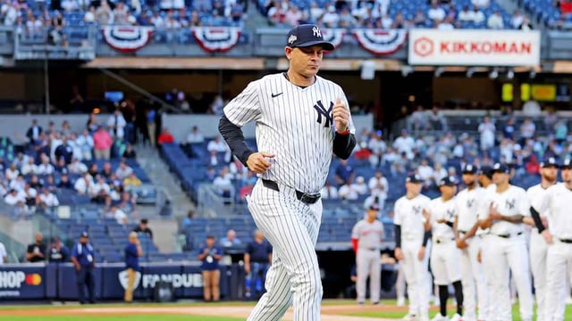 Sep 30, 2025; Bronx, New York, USA; New York Yankees manager Aaron Boone (17) runs on the field before the game against the Boston Red Sox during game one of the Wildcard round for the 2025 MLB playoffs at Yankee Stadium. Mandatory Credit: Brad Penner-Imagn Images