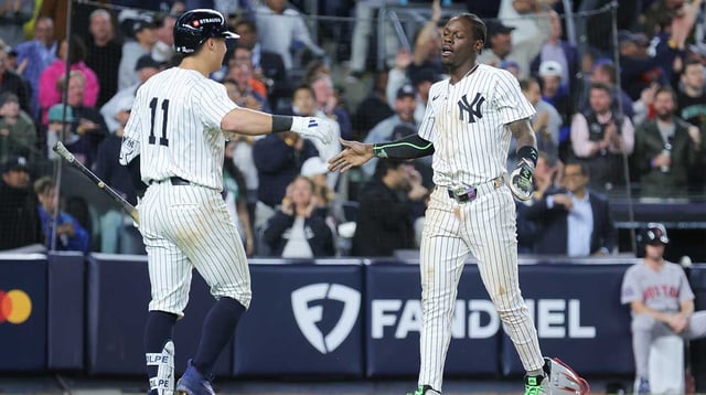 Oct 1, 2025; Bronx, New York, USA; New York Yankees second baseman Jazz Chisholm Jr. (13) scores on an hits an RBI single from New York Yankees catcher Austin Wells (28) (not pictured) during the eighth inning against the Boston Red Sox during game two of the Wildcard round for the 2025 MLB playoffs at Yankee Stadium. Mandatory Credit: Brad Penner-Imagn Images
