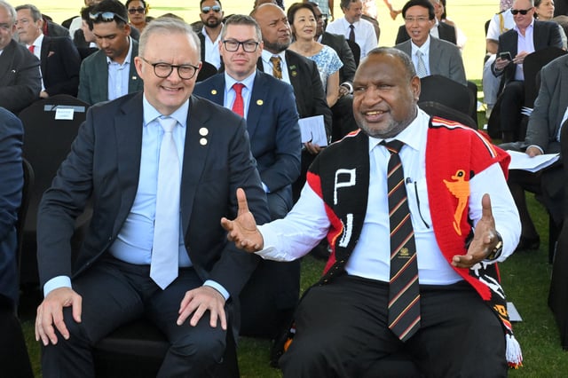 Australia’s Prime Minister Anthony Albanese and Papua New Guinea’s Prime Minister James Marape attend a flag lowering ceremony in Port Moresby, Papua New Guinea, September 16, 2025. AAP/MICK TSIKAS via REUTERS