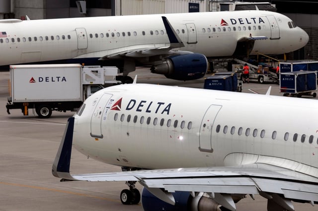 FILE - A Delta Air Lines plane leaves the gate July 12, 2021, at Logan International Airport in Boston. A Delta flight from Detroit to Amsterdam was diverted to New York's Kennedy Airport, Wednesday, July 3, 2024, after passengers were served spoiled food, airline officials said. (AP Photo/Michael Dwyer, File)