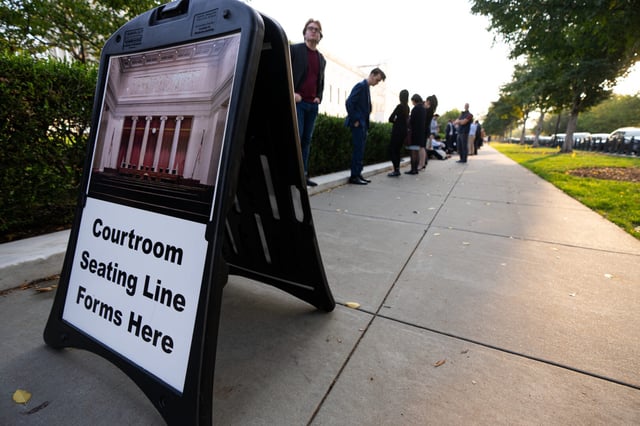 People wait in line for seating in the U.S. Supreme Court in Washington on the first day of the court’s new term in 2024.