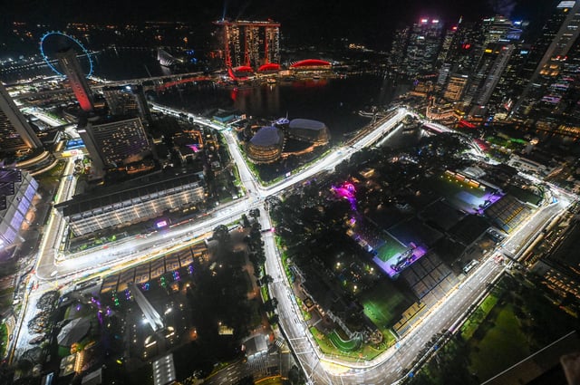 This photo shows the road circuit illuminated for the the upcoming Formula One Singapore Grand Prix at the Marina Bay Street Circuit in Singapore on October 1, 2025. (Photo by Roslan RAHMAN / AFP) (Photo by ROSLAN RAHMAN/AFP via Getty Images)