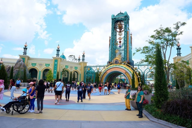 Guests arrive at the main entrance to Universal Epic Universe on Thursday, April 10, 2025, in Orlando, Fla.
