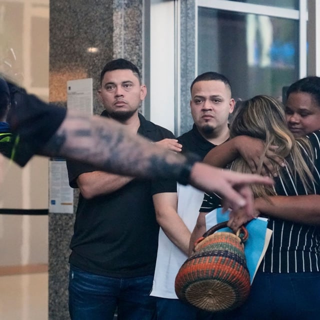 Kilmar Abrego Garcia, center, and his brother Cesar Abrego Garcia, left, arrive at the Immigration and Customs Enforcement field office in Baltimore, Monday, Aug. 25, 2025. (AP Photo/Stephanie Scarbrough)