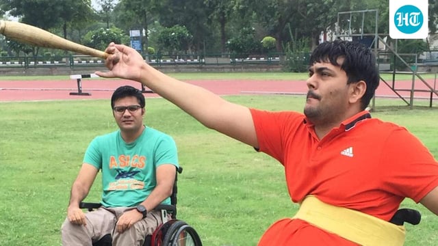  Amit Saroha (left) trains F51 club thrower Dharambir