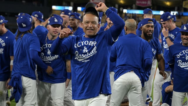 Oct 1, 2025; Los Angeles, California, USA; Los Angeles Dodgers manager Dave Roberts (30) celebrates after defeating the Cincinnati Reds in game two of the Wildcard round for the 2025 MLB playoffs at Dodger Stadium. Mandatory Credit: Jayne Kamin-Oncea-Imagn Images