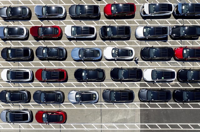 Tesla vehicles line a parking area at the company's Fremont, California, factory on August 5.