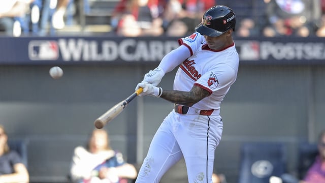 Oct 1, 2025; Cleveland, Ohio, USA; Cleveland Guardians shortstop Brayan Rocchio (4) hits a home run in the eighth inning against the Detroit Tigers during game two of the Wildcard round for the 2025 MLB playoffs at Progressive Field. Mandatory Credit: Ken Blaze-Imagn Images