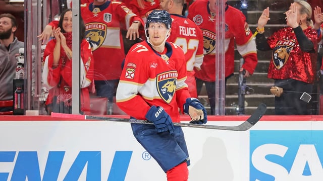 May 24, 2025; Sunrise, Florida, USA; Florida Panthers defenseman Niko Mikkola (77) celebrates after a goal during the third period against the Carolina Hurricanes in game three of the Eastern Conference Final of the 2025 Stanley Cup Playoffs at Amerant Bank Arena. Mandatory Credit: Sam Navarro-Imagn Images