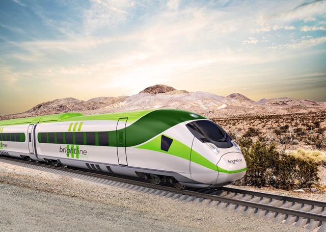 An artist’s rendering shows the high-speed rail train proposed by Brightline West in a view along an overpass of the 15 Freeway heading north. The federal government is backing the system, which would connect Southern California to Las Vegas with a $3 billion investment. (Courtesy of Brightline West)
