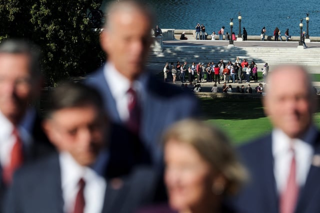 Visitors gather at the base of the West Lawn of the Capitol, during a press conference with U.S. Speaker of the House Mike Johnson (R-LA), Senate Majority Leader John Thune (R-SD) and other fellow Republicans, on the first day of a partial government shutdown, at the U.S. Capitol, in Washington, D.C., U.S., October 1, 2025.