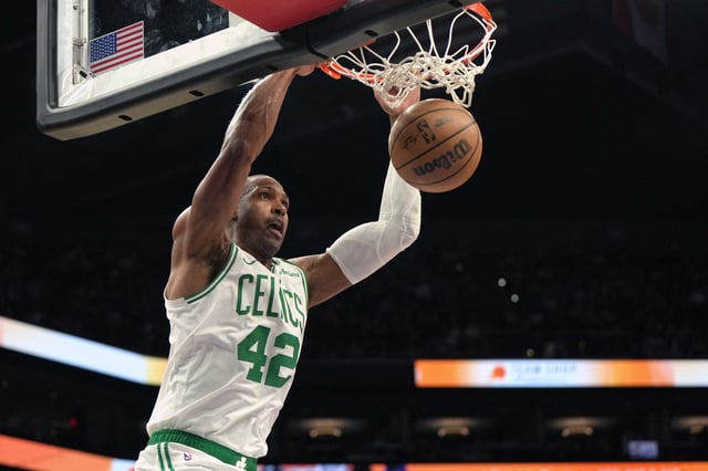 Mar 26, 2025; Phoenix, Arizona, USA; Boston Celtics center Al Horford (42) dunks against the Phoenix Suns during the second half at Footprint Center. Mandatory Credit: Rick Scuteri-Imagn Images