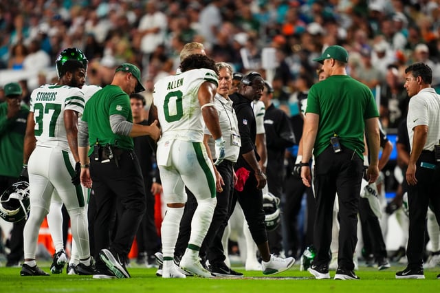 MIAMI GARDENS, FL - SEPTEMBER 29: Braelon Allen #0 of the New York Jets is helped off of the field during an NFL football game against the Miami Dolphins at Hard Rock Stadium on September 29, 2025 in Miami Gardens, Florida. (Photo by Cooper Neill/Getty Images)