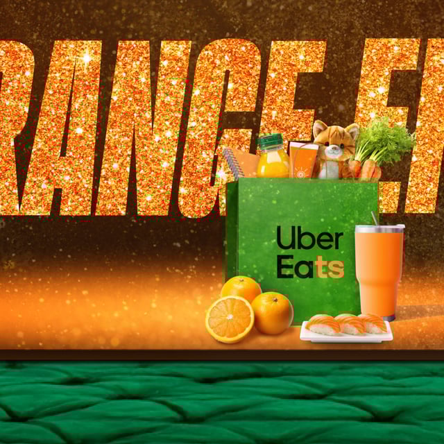 Uber Eats grocery bag full of orange items with "Orange Era" written across image