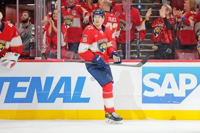 May 24, 2025; Sunrise, Florida, USA; Florida Panthers defenseman Niko Mikkola (77) celebrates after a goal during the third period against the Carolina Hurricanes in game three of the Eastern Conference Final of the 2025 Stanley Cup Playoffs at Amerant Bank Arena. Mandatory Credit: Sam Navarro-Imagn Images