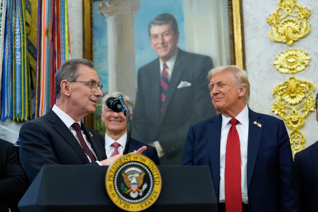 Albert Bourla, chairman and chief executive officer of the pharmaceutical company Pfizer, speaks in the Oval Office of the White House, Tuesday, September 30, 2025, in Washington, as President Donald Trump, right, and Mehmet Oz, Administrator for the Centers for Medicare and Medicaid Services, rear, look on.