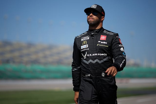 KANSAS CITY, KANSAS - SEPTEMBER 27: Bubba Wallace, driver of the #23 U.S. Air Force Toyota, walks the grid during qualifying for the NASCAR Cup Series Hollywood Casino 400 Presented by ESPN BET at Kansas Speedway on September 27, 2025 in Kansas City, Kansas. (Photo by Sean Gardner/Getty Images)