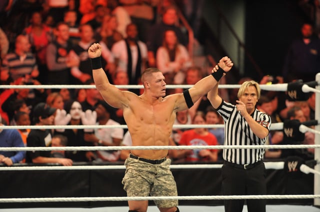 John Cena wins his match against the Miz at the WWE Monday Night Raw Supershow Halloween event at the Philips Arena on October 31, 2011 in Atlanta, Georgia.