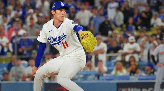 Oct 1, 2025; Los Angeles, California, USA; Los Angeles Dodgers pitcher Roki Sasaki (11) throws a pitch against the Cincinnati Reds in the ninth inning during game two of the Wildcard round for the 2025 MLB playoffs at Dodger Stadium. Mandatory Credit: Jayne Kamin-Oncea-Imagn Images
