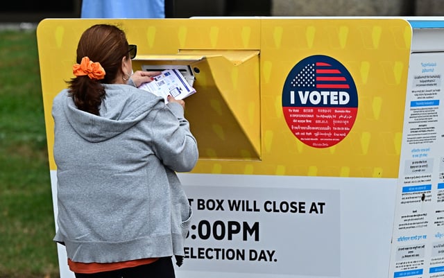 People drop off their ballots at the Los Angeles County Registrar on October 28, 2024, in Norwalk, California, two days after early voting in Los Angeles County began. Millions of US voters have already cast their ballots either by mail and drop-off boxes or in-person early voting ahead of the November 5 US presidential elections. (Photo by Frederic J. BROWN / AFP) (Photo by FREDERIC J. BROWN/AFP via Getty Images)
