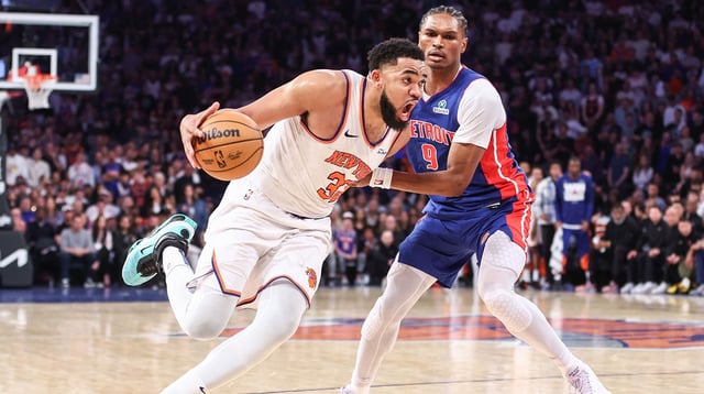 Apr 19, 2025; New York, New York, USA; New York Knicks center Karl-Anthony Towns (32) drives past Detroit Pistons forward Ausar Thompson (9) in Game One of the First Round of the NBA Playoffs at Madison Square Garden. Mandatory Credit: Wendell Cruz-Imagn Images