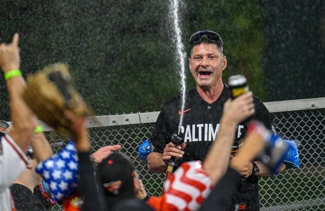 Retired Orioles pitcher Ben McDonald does a stint as the guest splasher in the Bird Bath during Friday’s game against the Boston Red Sox at Oriole Park at Camden Yards.
