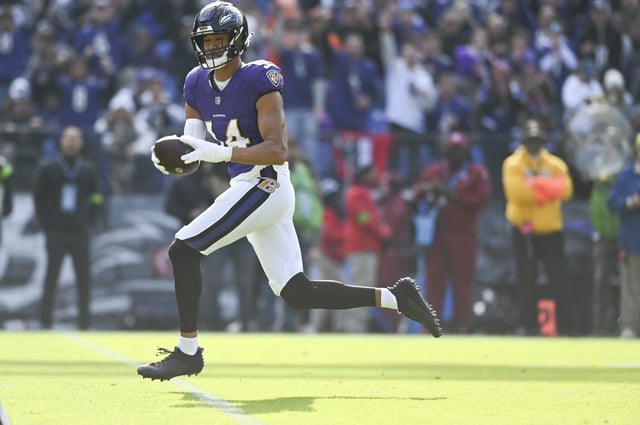 Nov 12, 2023; Baltimore, Maryland, USA; Baltimore Ravens safety Kyle Hamilton (14) returns a interception for a first quarter touchdown  against the Cleveland Browns  at M&T Bank Stadium. Mandatory Credit: Tommy Gilligan-USA TODAY Sports/ File Photo