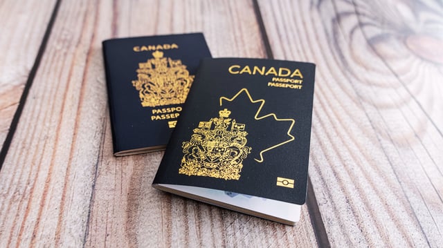 Two Canadian passports stacked on top of each other.
