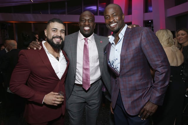 NEW YORK, NEW YORK - APRIL 05: WWE Superstar Andrade, WWE Superstar Titus O’Neil and Akbar Gbajabiamila attend the WWE Superstars For Hope Reception on April 05, 2019 in New York City.