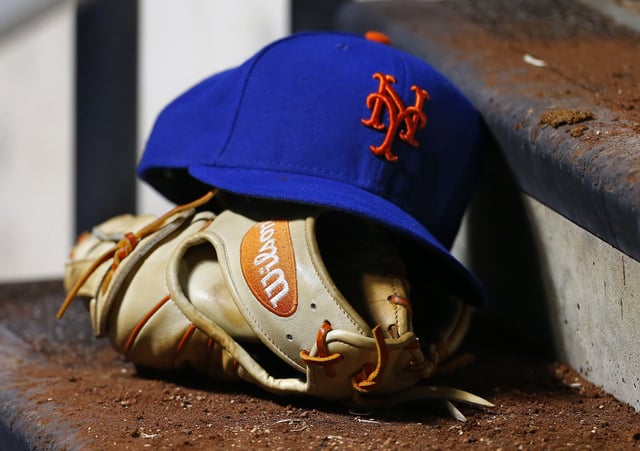 NEW YORK, NY - AUGUST 30: The cap and Wilson glove of David Wright #5 of the New York Mets sits on a dugout step during a game against the Philadelphia Phillies on August 30, 2014 at Citi Field in the Flushing neighborhood of the Queens borough of New York City. Former Mets outfielder Mark Bradley died.
