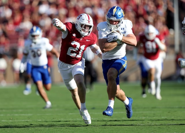 San Jose State Spartans’ Jackson Canaan (85) runs with the ball for a first down against the Stanford Cardinal’s Scotty Edwards (21) in the first half of a football game at Statanford Stadium in Stanford, Calif., on Saturday, Sept. 27, 2024. (Ray Chavez/Bay Area News Group)