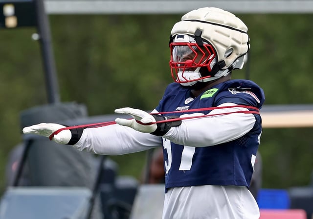 Foxboro, MA - Milton Williams stretches during Patriot’s practice at Gillette Stadium . (Nancy Lane/Boston Herald)