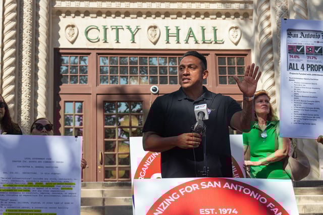COPS/Metro Alliance member Ruben Arciniega speaks at a press conference in front of City Hall on Oct. 2, 2025.