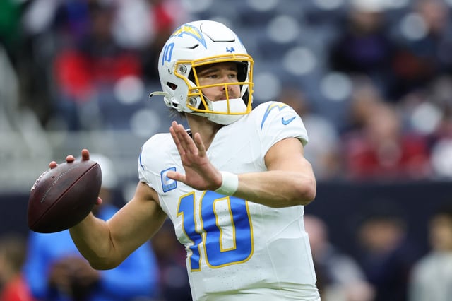 Justin Herbert #10 of the Los Angeles Chargers warms up prior to playing the Houston Texans during the AFC Wild Card Playoffs at NRG Stadium on January 11, 2025 in Houston, Texas.