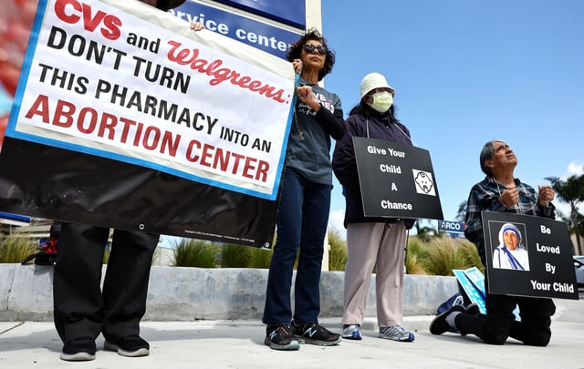 Demonstrators protest against abortion pill sales outside a CVS pharmacy on the same day the justices of the U.S. Supreme Court hears oral arguments in the case of the U.S. Food and Drug Administration v. Alliance for Hippocratic Medicine on March 26, 2024 in Torrance, California.