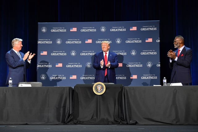 US President Donald Trump (C), flanked by Bishop Harry Jackson (R) and Pastor Robert Morris, hosts a roundtable with faith leaders, law enforcement officials, and small business owners at Gateway Church Dallas Campus in Dallas, Texas, on June 11, 2020. (Photo by Nicholas Kamm / AFP) (Photo by NICHOLAS KAMM/AFP via Getty Images)